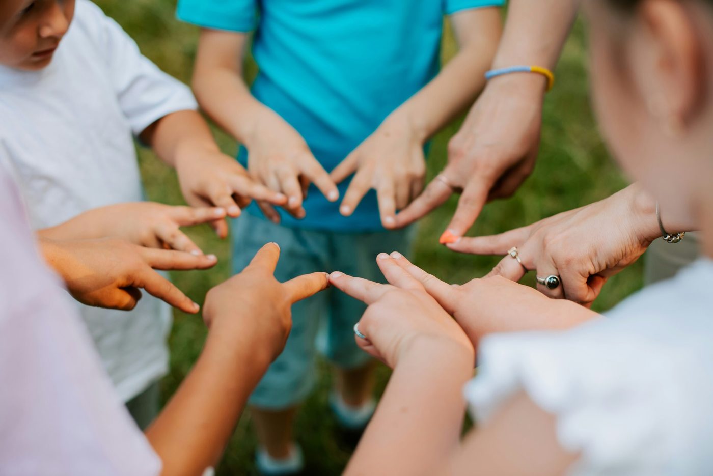 Young people standing together in a circle